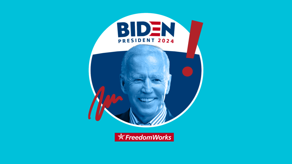 Pres. Joe Biden in front of a Biden 2024 banner.